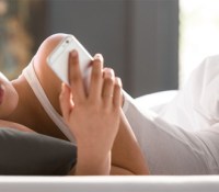desktop-woman-bed-phone