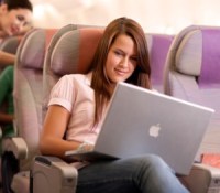 emirates-image-economy-class-woman-and-laptop-onboard-emirates-a380