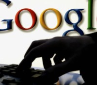 FRANKFURT/MAIN, Germany:  A woman works on her computer as on the wall behind is seen the logo of web search engine Google at Frankfurt's international book fair, on 23 October 2005, the fair's last day. South Korea is the guest of honour at the 57th annual Frankfurt Book Fair and has brought out 62 authors to Germany to introduce them to the western public. Some 270.000 people are expected to visit the world's most important book fair, and 7000 exhibitors from 100 countries are present. AFP PHOTO DDP/TORSTEN SILZ GERMANY OUT  (Photo credit should read TORSTEN SILZ/AFP/Getty Images)