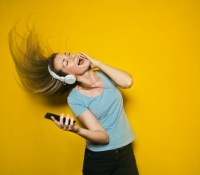 someone with headphones unsplash