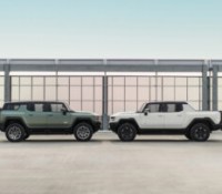 Side profile image of the 2024 GMC HUMMER EV Edition 1 SUV in Moonshot Green Matte (left) and the 2023 GMC HUMMER EV Edition 1 Pickup in Interstellar White (right).