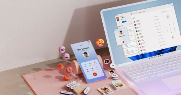 msft-open-laptop-with-mobile-phone-floating-emojis-RW10WBx msft-open-laptop-with-mobile-phone-floating-emojis-RW10WBx
