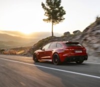 Progressiv red metallic, outdoor dynamic photo, exterior, three-quarter rear view