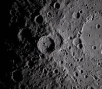 art002e009282 (April 6, 2026) - A close-up view taken by the Artemis II crew of Vavilov Crater on the rim of the older and larger Hertzsprung basin. The right portion of the image shows the transition from smooth material within an inner ring of mountains to more rugged terrain around the rim. Vavilov and other craters and their ejecta are accentuated by long shadows at the terminator, the boundary between lunar day and night. The image was captured with a handheld camera at a focal length of 400 mm, as the crew flew around the far side of the Moon.