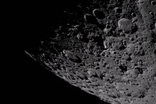 art002e009283 (April 6, 2026) – Captured by the Artemis II crew, the heavily cratered terrain of the eastern edge of the South Pole-Aitken basin is seen with the shadowed terminator – the boundary between lunar day and night – at the top of the image. The South Pole-Aitken basin is the largest and oldest basin on the Moon, providing a glimpse into an ancient geologic history built up over billions of years.