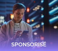 Handsome Man Using Smartphone Walking Through Night City Full of Neon Colors and Entertainment. Stylish Young Man Using Mobile Phone, Posting on Social Media, Online Shopping, Texting on Dating App