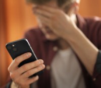 medium-shot-suffering-teenager-being-cyberbullied